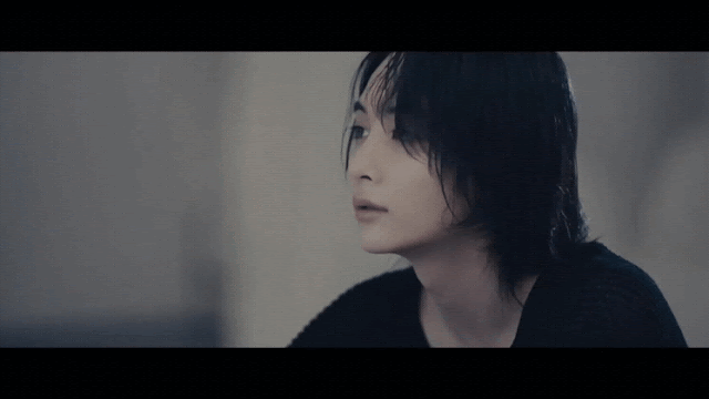 Gif from the music video of "Last Night" by Jeonghan and Wonwoo where Jeonghan looks down sadly