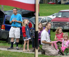 waiting to see the parade, floats, band