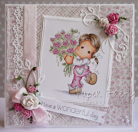 Pink and girly card featuring Tilda with flowers, and pearl, flower and ribbon details