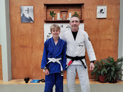 Professor Adam Evans with the Sol Auckland Kids BJJ