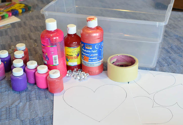 Valentine's Day Marble Painted Hearts and Valentine Garland- fun and easy painting process art activity for Valentine's Day. Great for preschool, kindergarten, or elementary kids. Leave as is or string into a pretty garland for decoration!