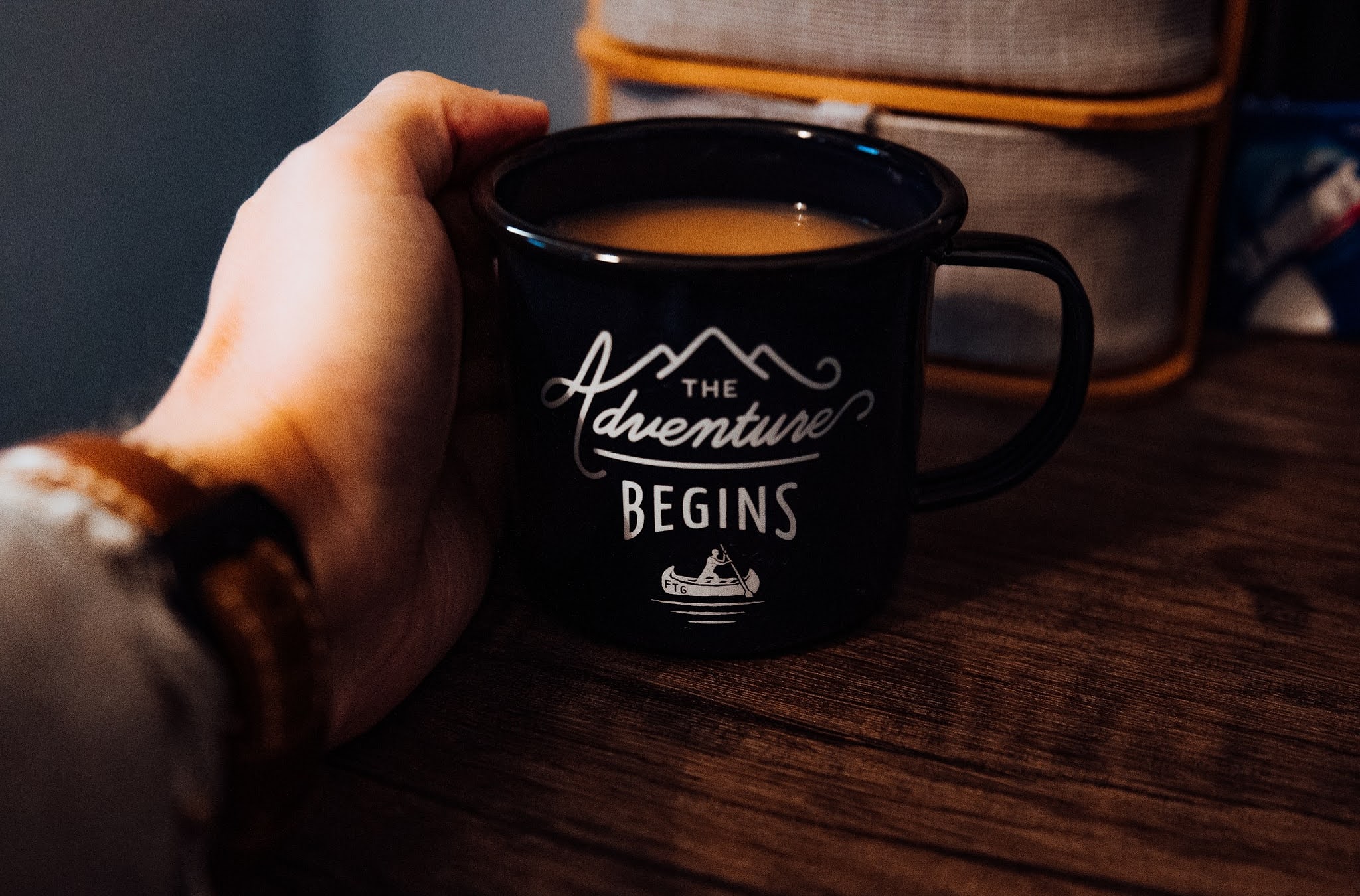 holding a cup of tea