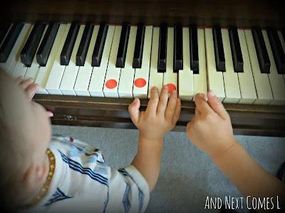 Playing chords on the piano using dot stickers from And Next Comes L