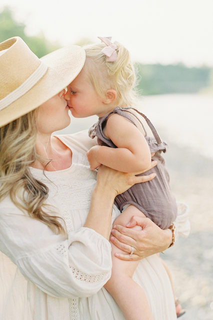 Mom Holding Kissing Baby