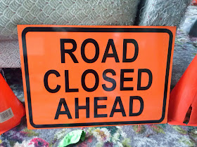 Road closed ahead sign