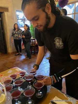 server with spicy blackberry-habanero margaritas in La Posta de Mesilla in Mesilla, Las Cruces, New Mexico