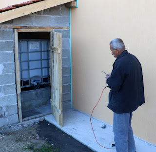 Another door is hung on the reservoirs