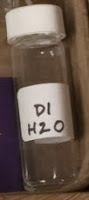 tiny vial of deionized water