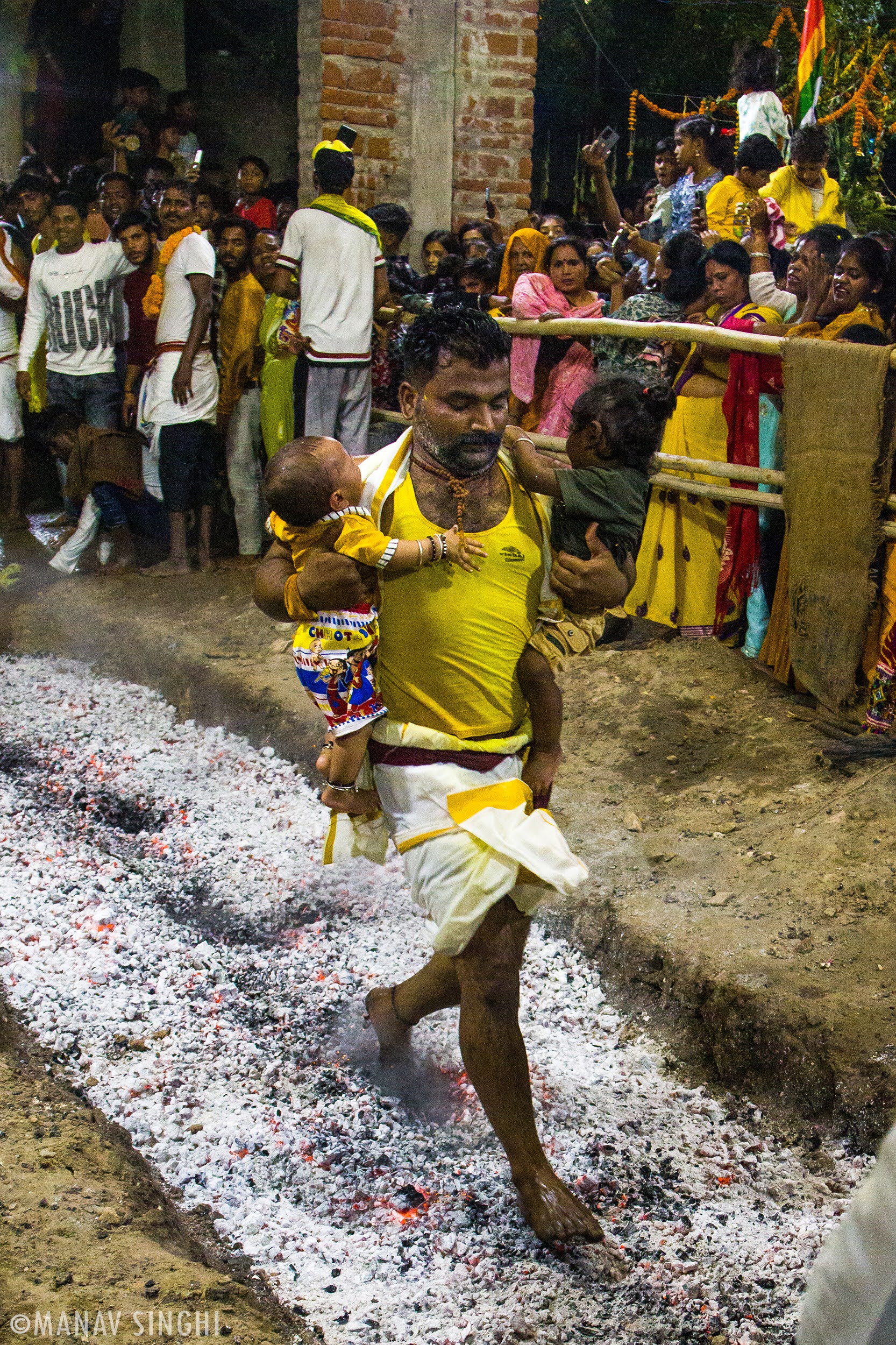 Tamil Hindu Devotee Father with Kids Fire Walking at Blazing Coal Pit Jaipur.