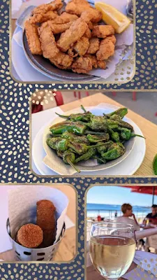 Collage of dishes for lunch at Carcavelos Beach against a black and white spotted background. Dishes include choco frito, croquettes, a glass of wine, and padron peppers