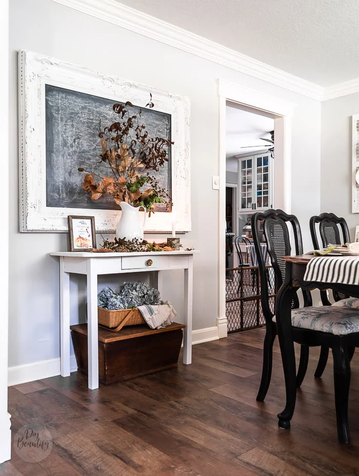 dining room chalkboard and side table with Fall foliage, seed pods, leaves and berries