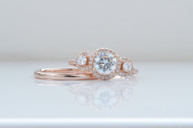 rose gold and moissanite engagement ring