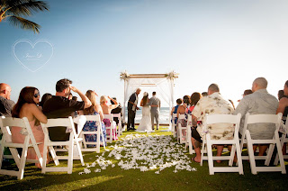 Kauai Wedding Minister at the Beach House wedding ceremony with flowered aisle