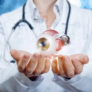 doctor holding eye in hands