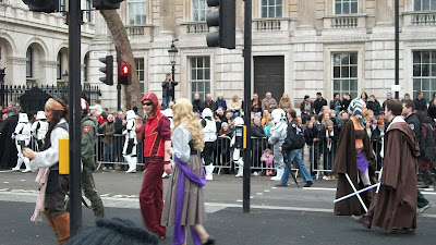 Some Disney characters and Star Wars characters wandering in the middle of the parade.