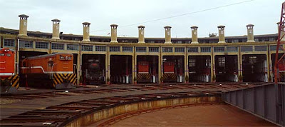 Railway roundhouse railroad shed for the storage housing of steam locomotive engines at night times