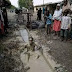 Another Man Dips Himself Inside Dirty Gutter To Celebrate Buhari’s Re-election 