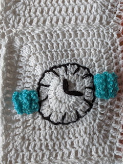 Granny square with watch face in centre