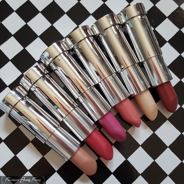 row of silver chrome lipsticks on checked background