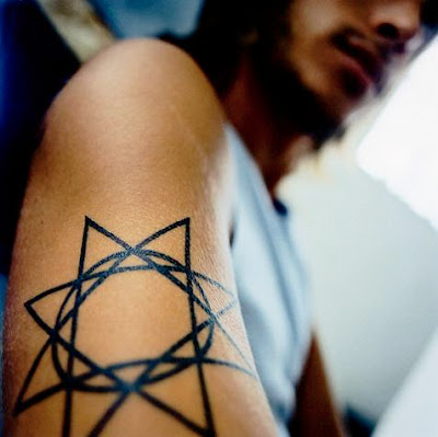 star tattoo around elbow