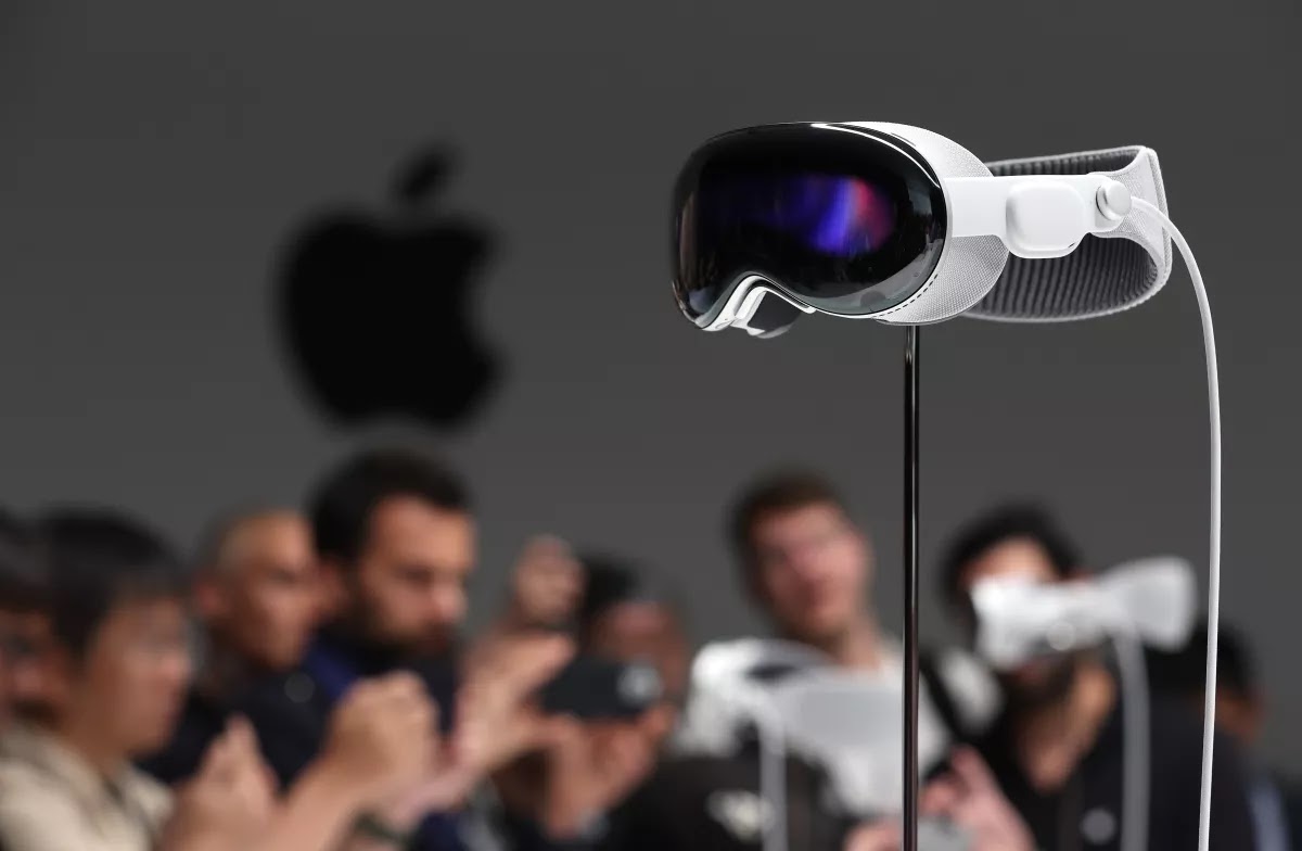 Apple's Vision Pro headset is displayed on a stand