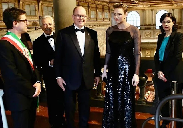 Princess Charlene wore crew-neck jacket and trousers by Emporio Armani, and tulle and sequin long sleeve a-line gown by Akris