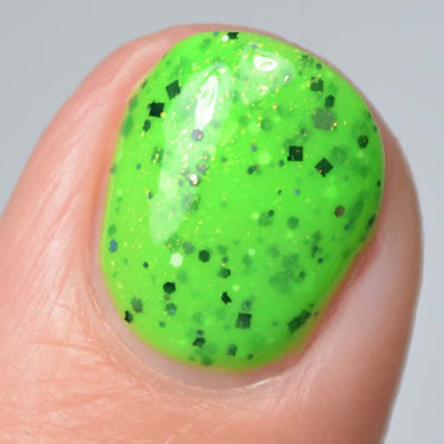neon green nail polish with glitter swatch