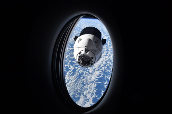 As seen from inside SpaceX's Crew Dragon Freedom capsule, the Dragon CRS-25 freighter is about to dock with the International Space Station...on July 16, 2022.