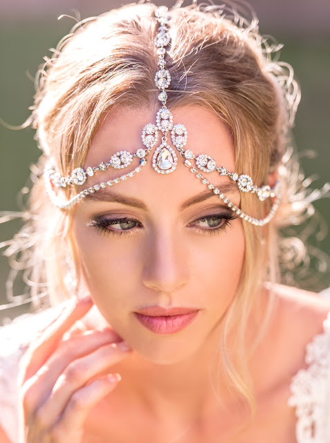 http://amyobridal.com/store/product/enchanted-crystal-tierd-headpiece/