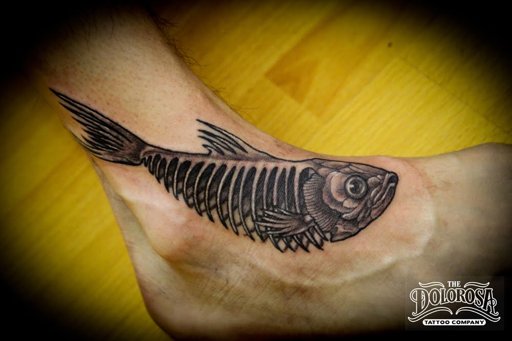 Heathcliff fish bones tattoo on the foot of an old loyal customer.