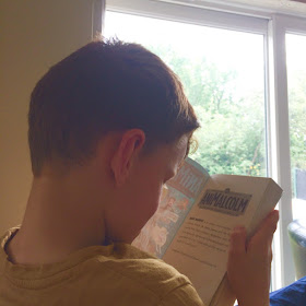 Anthony reading the AniMalcolm novel