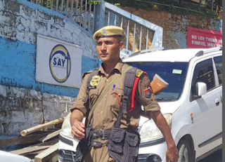 A close-up photograph of Constable Sabin Nath, a member of the Assam Police, who has gone missing in Saitual, Mizoram