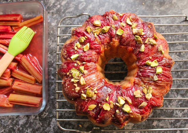 Food Lust People Love: Orange almond cake batter is spooned onto sweet roasted rhubarb and baked to golden perfection for a beautiful dessert your whole family will adore. Drizzled with the sticky rhubarb syrup and topped with chopped pistachios for a hit of color and crunch, this roasted rhubarb upside down cake is our new favorite sweet treat.