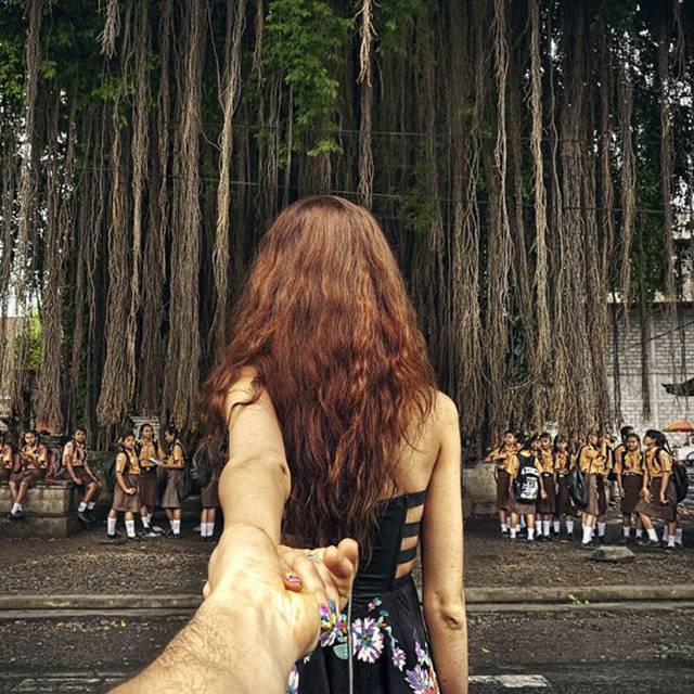 Photographer Murad Osmann creatively documents his travels around the world with his girlfriend leading the way in his ongoing series known as Follow Me To. Chronicling his adventures on Instagram, the Russian photographer composes each shot in a similar fashion. We see each landscape from the photographer's point of view with his extended hand holding onto his girlfriend's in front of him.