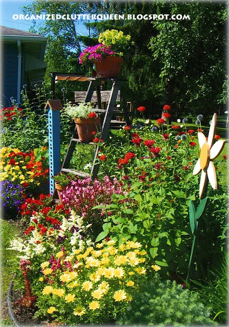 Using Red Blossoms in Garden & Pots www.organizedclutterqueen.blogspot.com