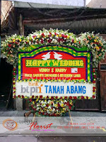 bunga papan pernikahan, bunga ucapan selamat, toko karangan bunga, toko bunga jakarta, toko bunga, florist jakarta, karangan bunga happy wedding, bunga papan grand opening