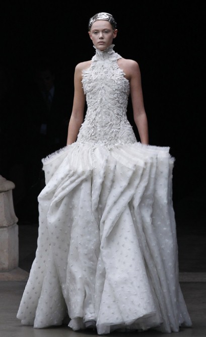 The gown features an ivory tulle bodice fully 