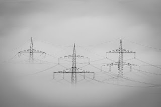 <img src="img_pylons in the fog.jpg" alt="Can we find a solution to power cuts?">