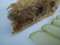 A slice of rabbit pie with granny smith apples.