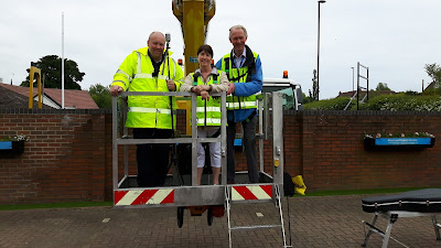 christine deponio and brian burnie in a cherry picker