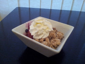 Peach blueberry crisp with whipped cream