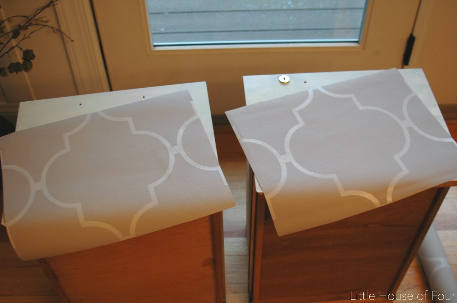 cut two pieces and then wallpapered them to each drawer.