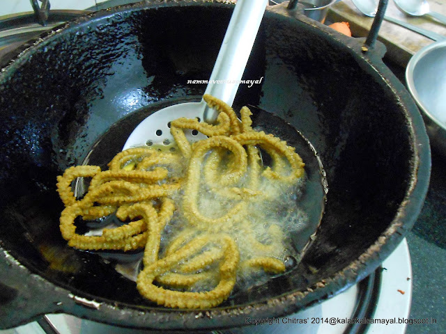 Flip Kambu Murukku [ Pearl Millet Murukku ] frying in the oil to fry the other side