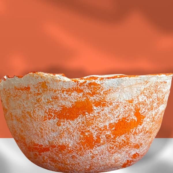 orange and white rustic paper mache bowl