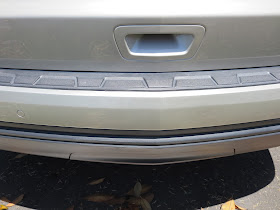 Scrapes on bumper repaired and factory paint re-applied at Almost Everything Auto Body.