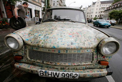 Car covered with thousands of stamps