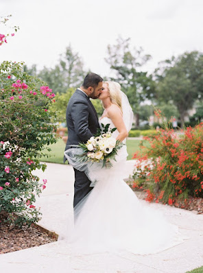 bride and groom kiss