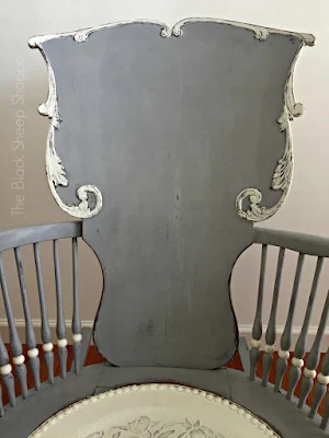 Seat back of painted rocking chair