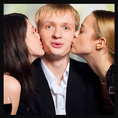 Two girls kissing a bride