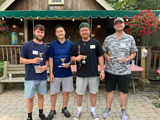 Corcoran Management Company employees with their mini trophies at Kimball Farm
